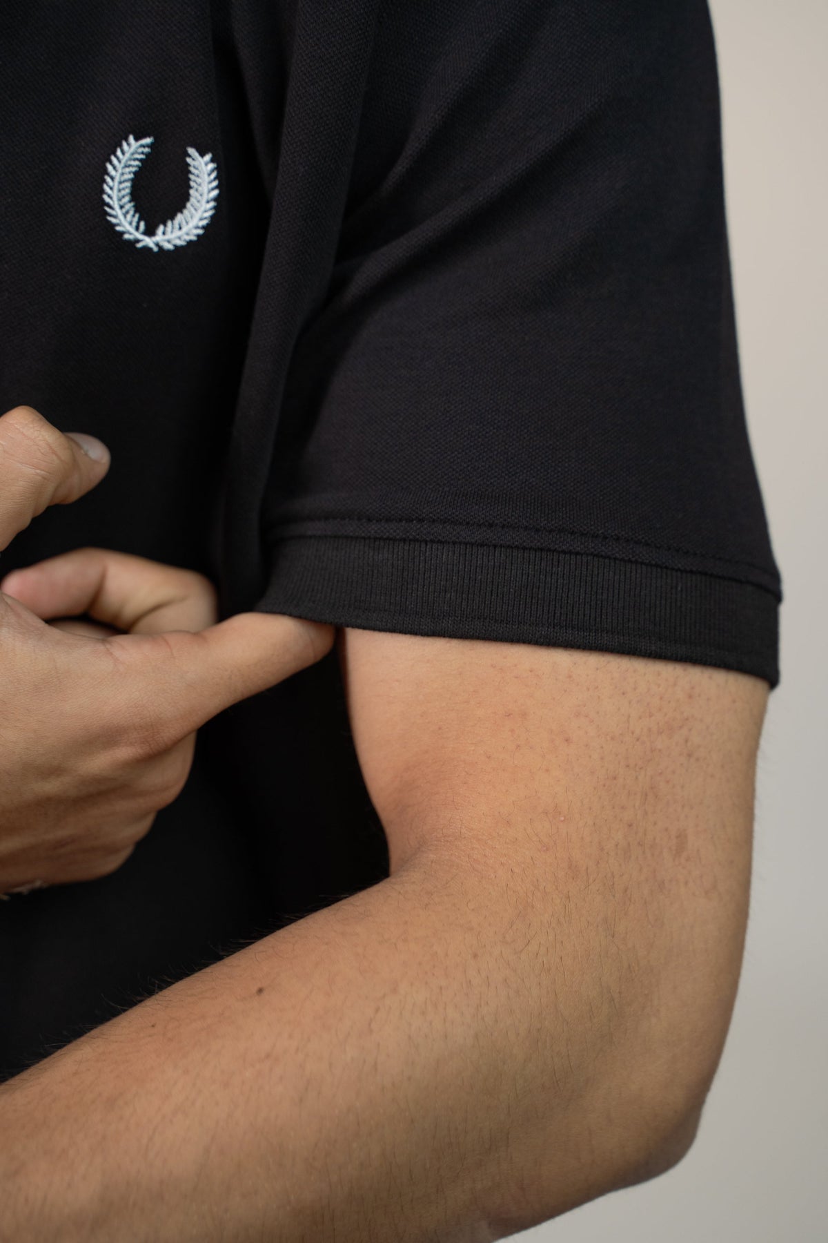 Buttonaire Polo | Laurel Stretch – Obsidian Black